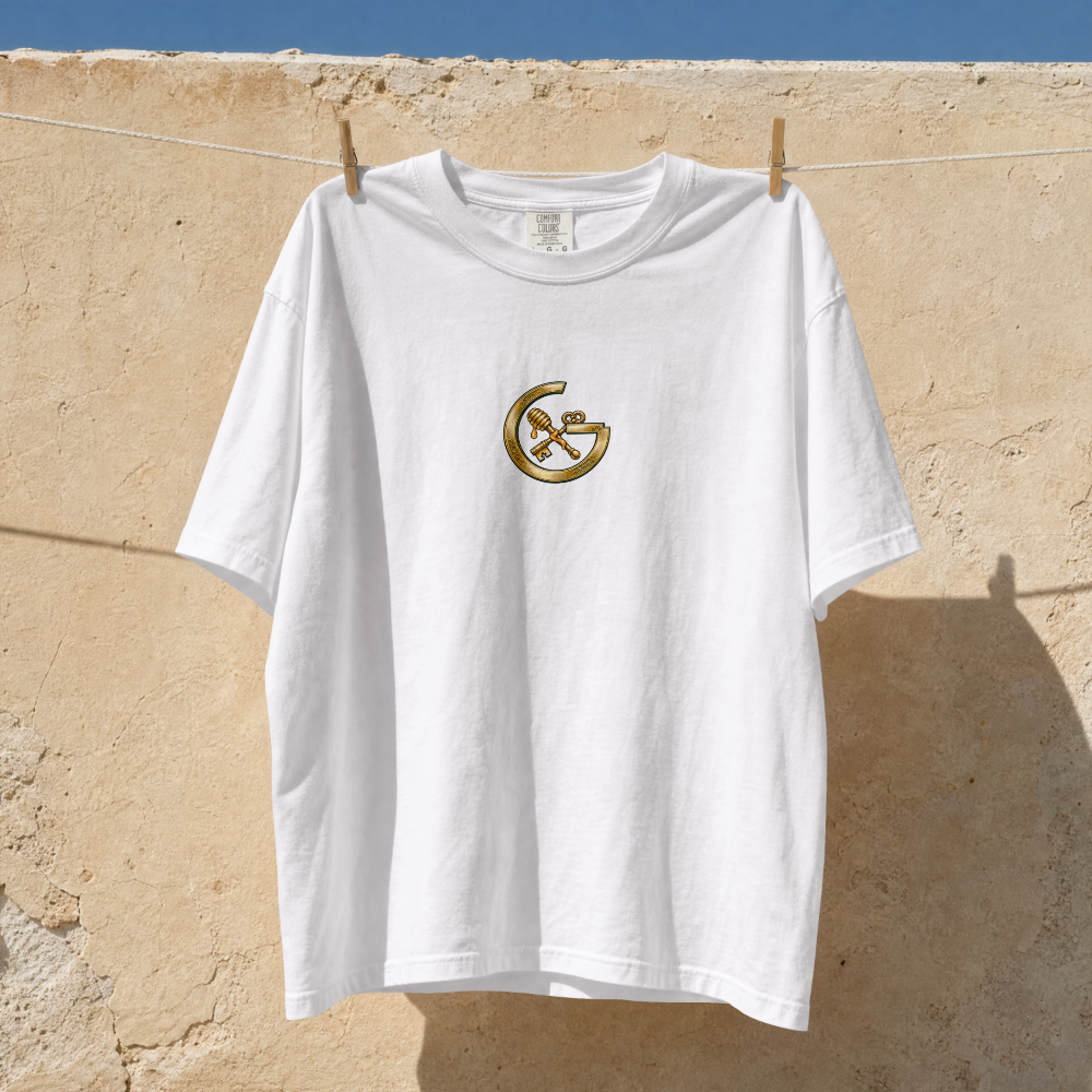 GRITO Liquid Gold Tee in white — front chest mark