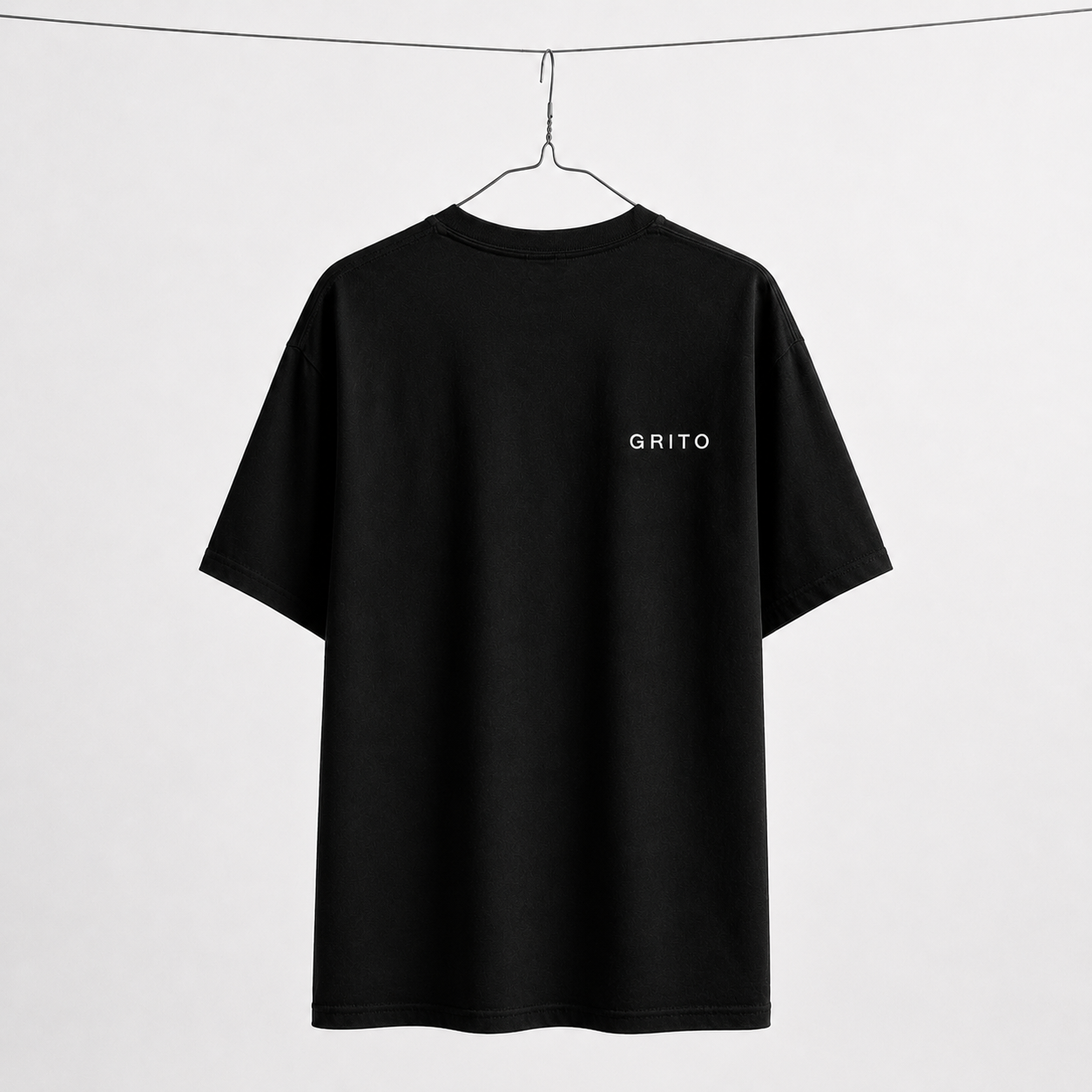 GRITO Core Tee in black — back with the white GRITO wordmark