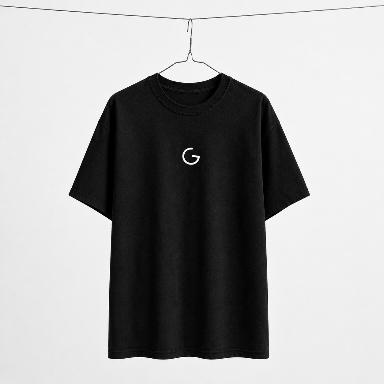 GRITO Core Tee in black — front with the white G mark